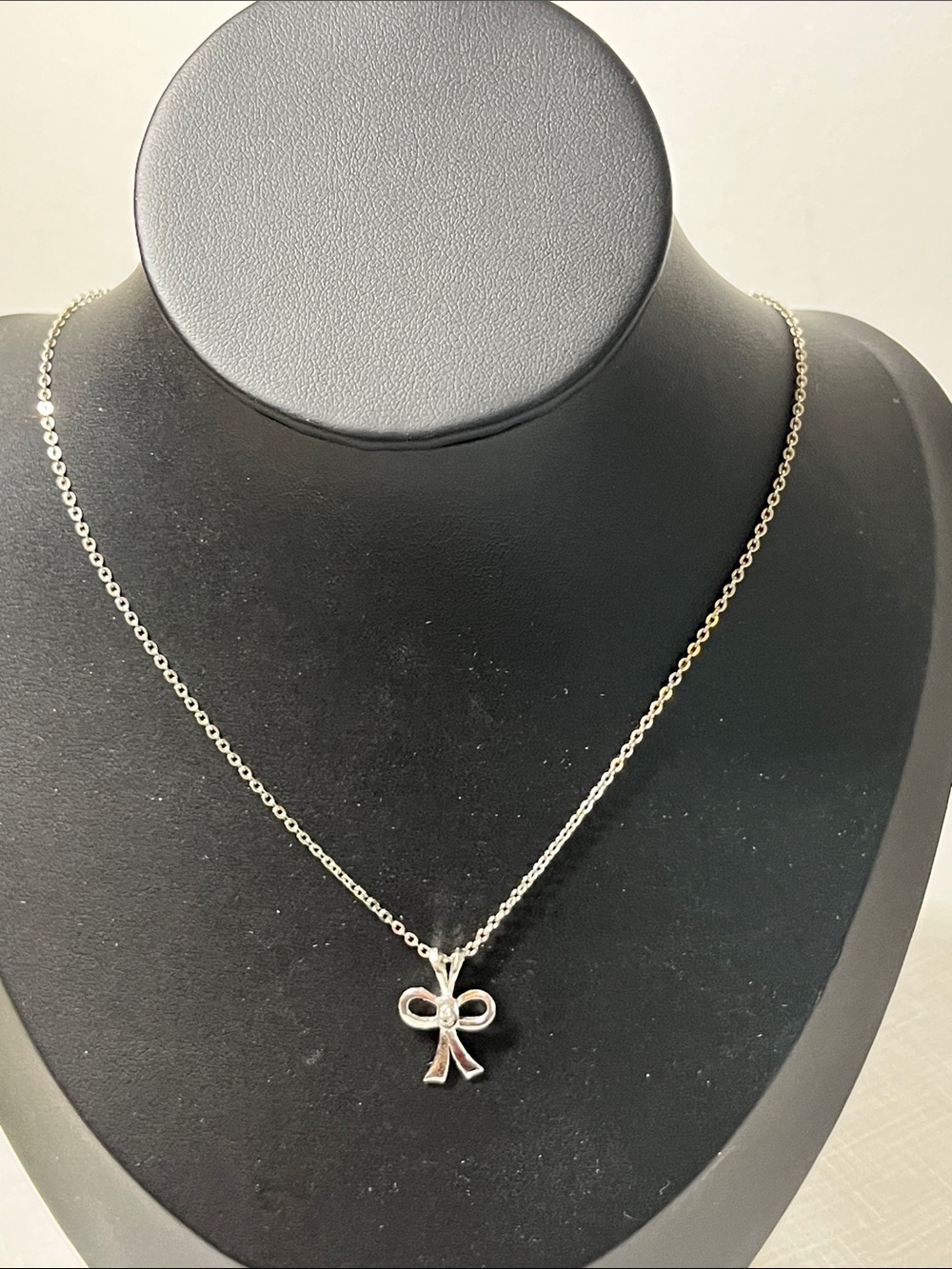 Silver-tone Bow Pendant Necklace 
Stamped SN